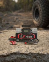 Thor's Lightning StrikePro 12V portable air compressor on a granite rock at the trail