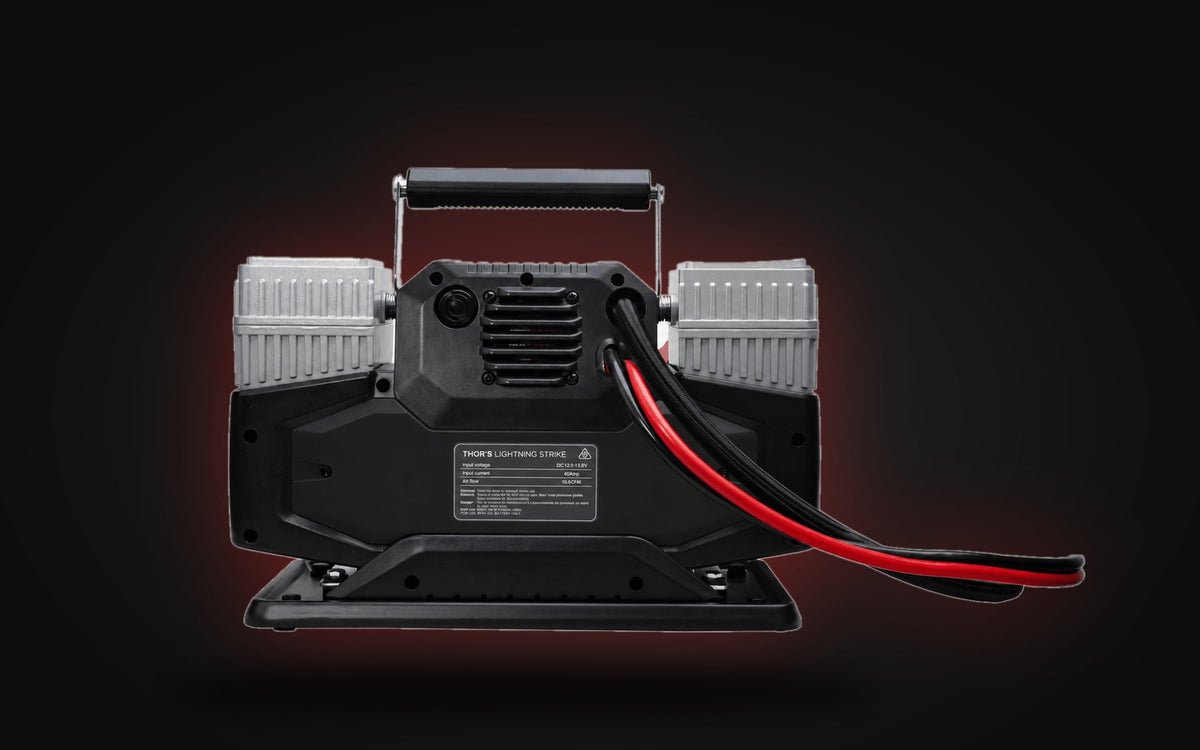 StrikePro compressor showing cooling fan and heavy-gauge wiring